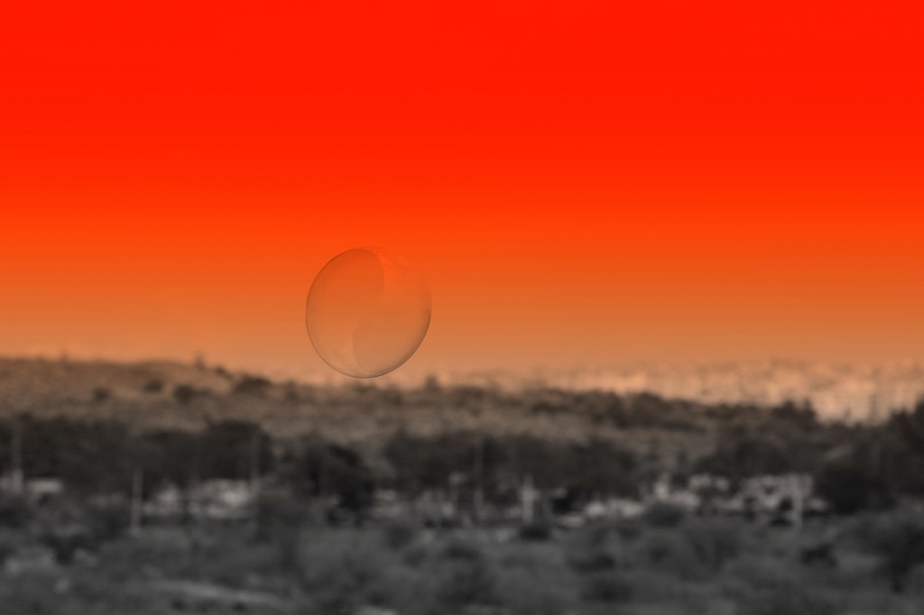 Flight of the bubble-against a red sky.