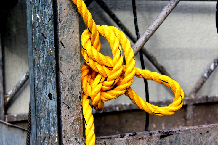 Yellow rope on window cleaning platform.